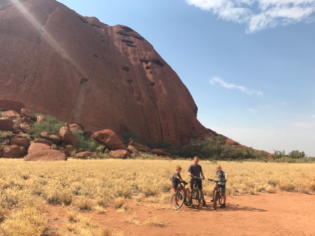Riding around the base of Uluru